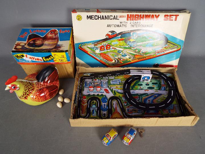 LTI Lucky Toys, Other - Two boxed tinplate toys.