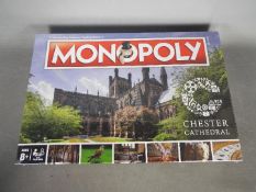 Monopoly - A boxed factory sealed Monopoly 'Chester Cathedral' game.