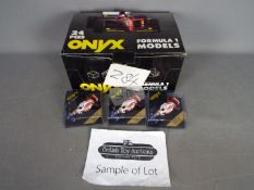 Onyx - A trade box of 24 diecast 1:43 scale diecast F1 racing cars.