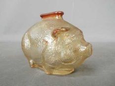 A vintage carnival glass money bank in the form of a pig by Anchor Hocking, approximately 7.
