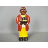 A vintage, American, ceramic money bank in the form of 'Uncle Mose',
