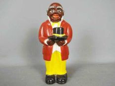 A vintage, American, ceramic money bank in the form of 'Uncle Mose',