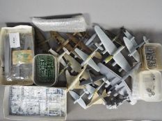 A large quantity of part built model aircraft in various scales,