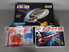 Two boxed plastic model kits.