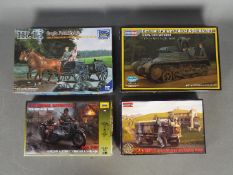 Four Boxed plastic model kits.