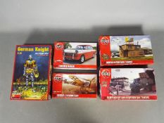 Five Boxed plastic model kits.