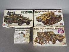 Tamiya - Four boxed plastic military vehicle model kits in 1:35 scale by Tamiya.