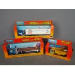 Ertl - Three boxed vintage Ertl diecast model truck Lot consists of ‘Mighty Movers of the World’