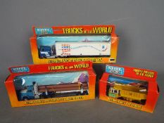 Ertl - Three boxed vintage Ertl diecast model truck Lot consists of ‘Mighty Movers of the World’