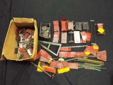 Meccano - A quantity of unboxed vintage Meccano, mainly red and green, plus some gold pieces.