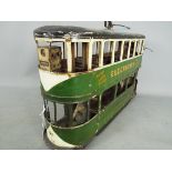 A scratch built wooden model of a double deck Liverpool Corporation Tramcar.