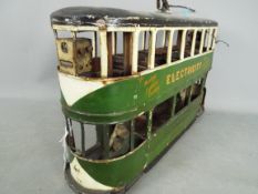 A scratch built wooden model of a double deck Liverpool Corporation Tramcar.