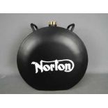 A black Norton petrol can,