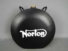 A black Norton petrol can,