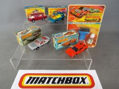 Matchbox - A collection of 4 boxed Matchbox vehicles and a Superfast Tune Up Kit.