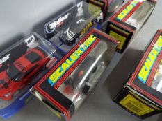 Scalextric - A collection of 6 Scalextric cars and a boxed set of trackside figures.