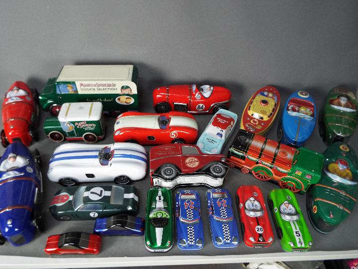 Marks And Spencer - A collection of 21 transportation themed biscuit tins including vintage racing