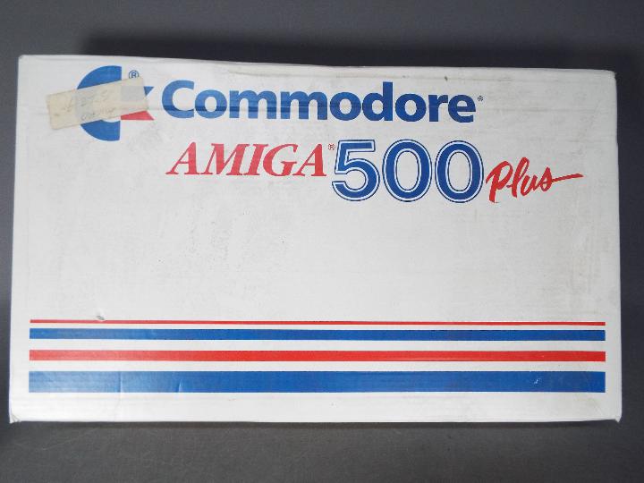 Commodore - Boxed Commodore Amiga 500 Plus. It appears undamaged but would benefit from cleaning.