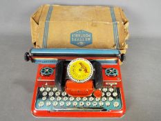 Mettoy - A boxed Mettoy Mettype 'Junior' Typewriter.