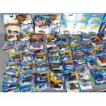Hot Wheels - A collection of over 60 unopened Hot Wheels vehicles including # X1904 Mini Countyrman