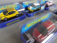 Scalextric - A collection of 5 boxed Scalextric cars including # CC3224 Morris Mini Cooper,