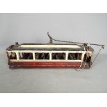 A scratch built wooden model of a single deck Liverpool Corporation Tramcar.