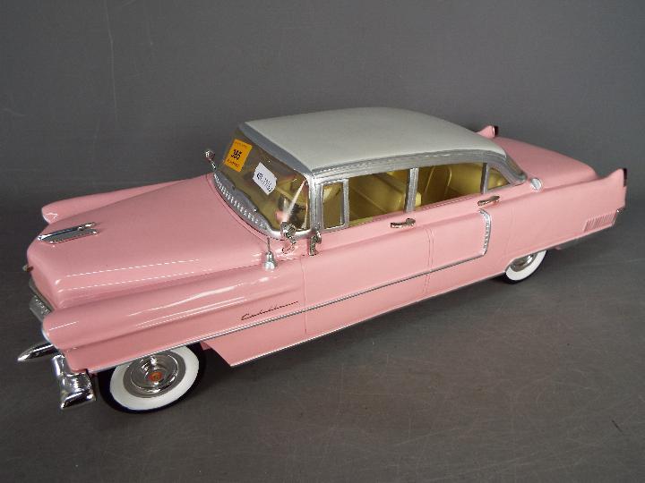 The Bradford Exchange - A limited edition cast resin 1:12 scale Elvis Presley 1955 pink Cadillac