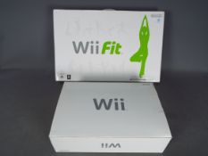 Nintendo - Wii - Boxed Nintendo Wii and boxed Wii Fit, show signs of use,