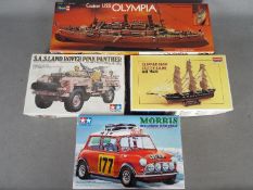 Tamiya, Revell, Academy - Four boxed plastic model kits in various scales.