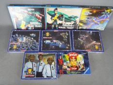 King ,Waddingtons, Gerry Anderson - Eight boxed 'Gerry Anderson' themed jigsaw puzzles.