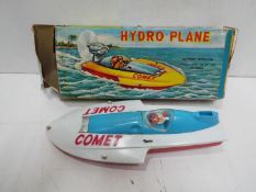 MIC - A boxed MIC (Hong Kong) plastic battery operated Hydro Plane 'Comet' boat, with red hull,