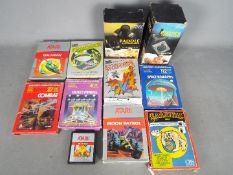 Atari, Parker - Two boxed Atari controllers and a small collection of video games.