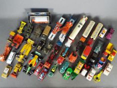 Matchbox - Corgi - Bburago - A lot of over 30 mostly loose and play worn diecast vehicles in
