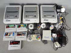 Super Nintendo - A lot of 3 1992 dated Super Nintendo consoles with a power adaptor,