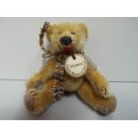 Witney - Teddy bear - "Aloysius". Jointed. Paper name tag necklace. 10cm high.