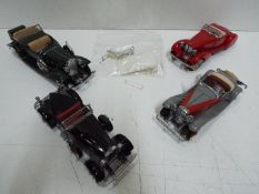 Danbury Mint - Four unboxed 1:24 scale diecast model cars by Danbury Mint.