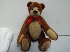 W.M.B. - Trendle - Brown jointed Teddy Bear - No. 963. Red bow and gold colour badge. Certificate.