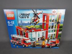 LEGO - a Lego City 60004 Fire Station construction set factory sealed.