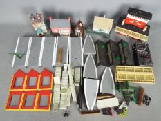 Hornby - A collection of unboxed Hornby OO gauge plastic scenic buildings and railway accessories.