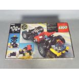 LEGO 8860 - a Lego 8860 technical set, box is open with parts organised into compartments,