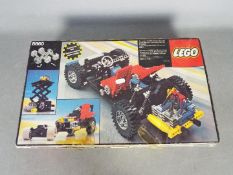 LEGO 8860 - a Lego 8860 technical set, box is open with parts organised into compartments,