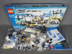 LEGO - # 7743 City Police Command Centre set in an open box with the parts in zip lock bags so it