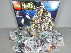 LEGO - # 10228 Monster Fighters Haunted House set in an open box with parts in zip lock bags so it