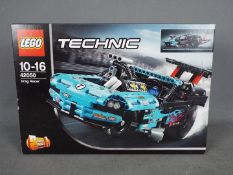 LEGO - A boxed Lego Technic set #42050 'Drag Racer'.