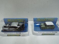 Scalextric - Mini Cooper S Goodwood # C4059 and Bentley Continental GT3 C4057A in perspex display