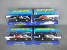 Scalextric 4 x Lotus Type 49 models in different liveries/ # C2964, # C3031, # C3092, # C 3311.