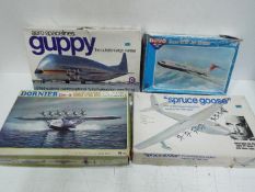 Otaki, Entex; Novo - Four boxed vintage plastic model aircraft kits in 1:144 scale.