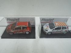 Flyslot - 2 x Fiat Punto S2000 rally cars models in perspex display cases. # M04101, # M04102.