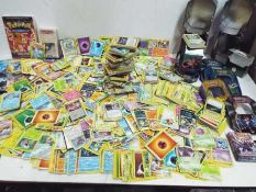 POKEMON - A large collection of over 2,500 mainly loose POKEMON trading cards from various series.