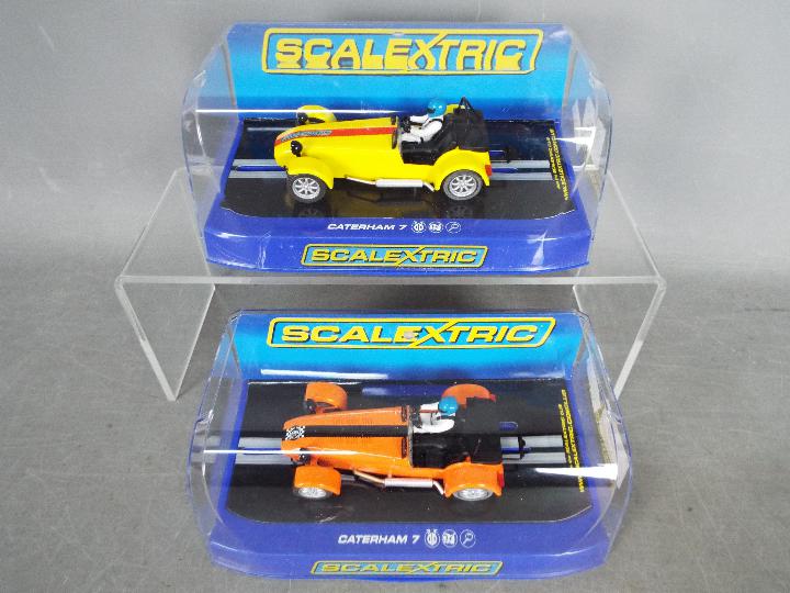 Scalextric - 2 x Caterham 7 limited edition slot cars.